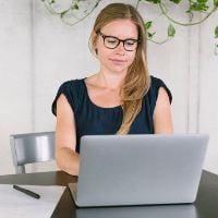 Contentfish Copywriter at work at her laptop